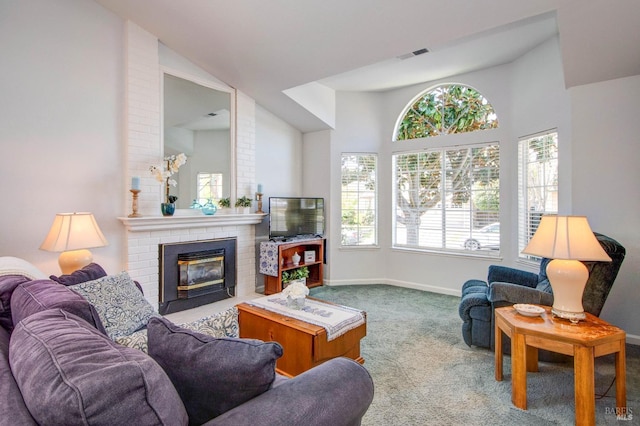 living area with carpet floors, a fireplace, baseboards, lofted ceiling, and visible vents