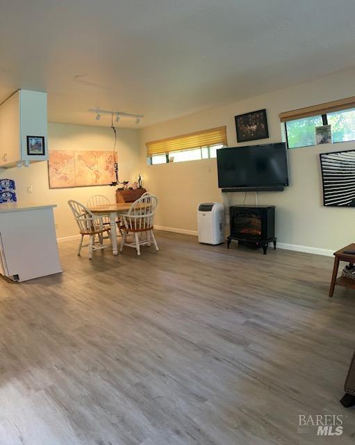 105 Virginia Ave Unit 1, Sebastopol, CA 95472 - dining area with baseboards, track lighting, and wood finished floors