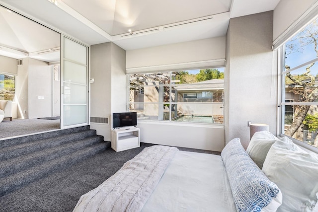 bedroom featuring carpet and visible vents