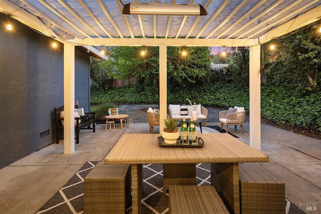 patio at twilight featuring a pergola and an outdoor living space