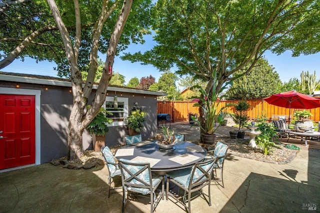 1416 F St, Napa, CA 94559 - fenced backyard featuring outdoor dining area, a patio area, an outdoor structure, and area for grilling