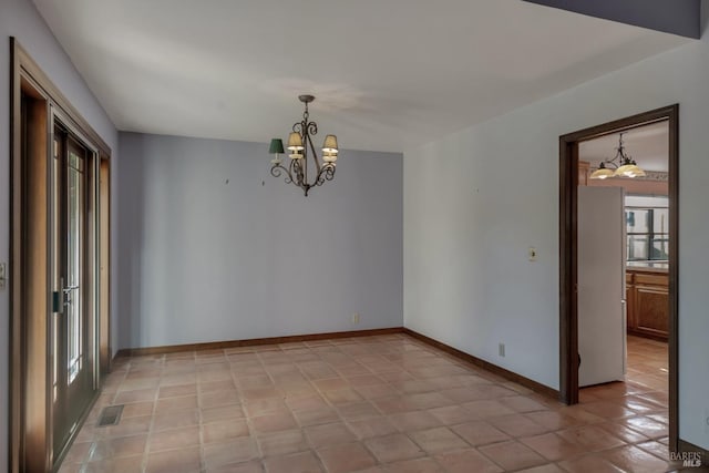 spare room with baseboards, visible vents, an inviting chandelier, and light tile patterned floors