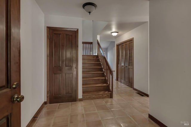 stairs featuring baseboards