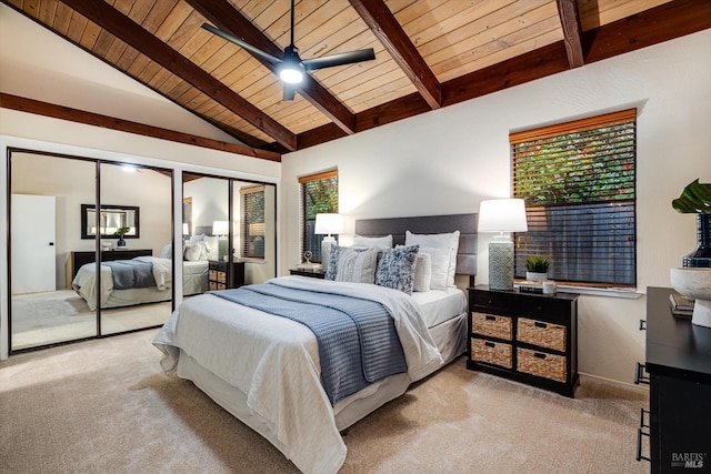 bedroom with multiple windows, carpet floors, wooden ceiling, and lofted ceiling with beams