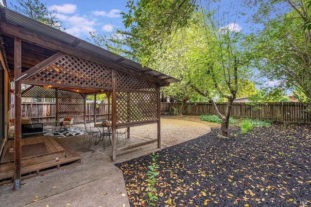 view of yard with a fenced backyard, a gazebo, and a patio