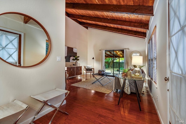 interior space featuring lofted ceiling with beams, wooden ceiling, and wood finished floors