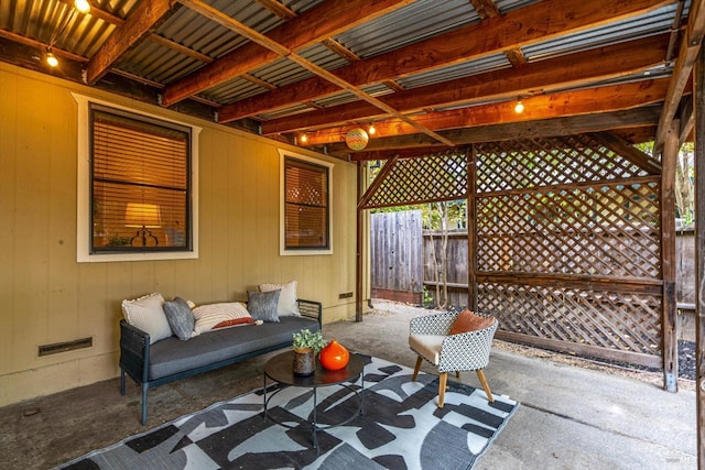 view of patio featuring fence and visible vents