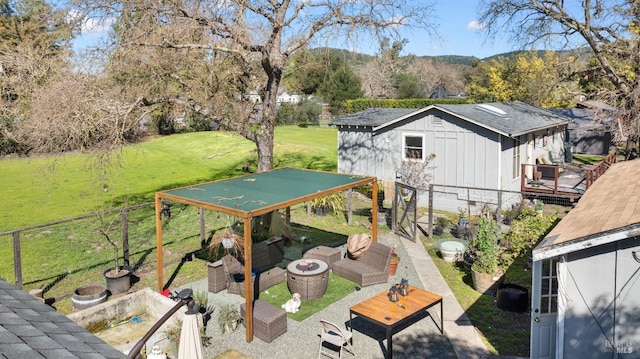 exterior space with fence, a patio area, and an outdoor living space with a fire pit