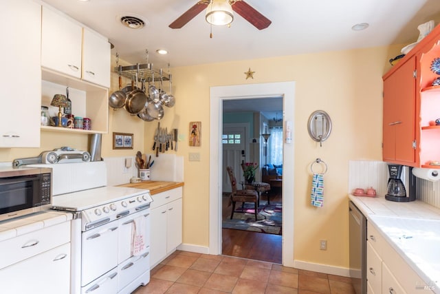 kitchen with ceiling fan, open shelves, stainless steel appliances, and visible vents