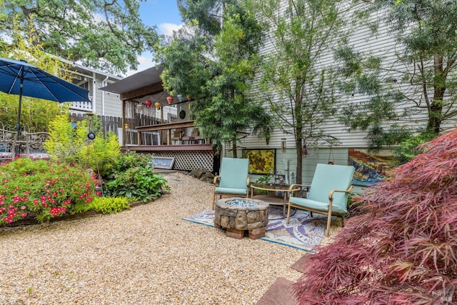 view of patio featuring an outdoor fire pit