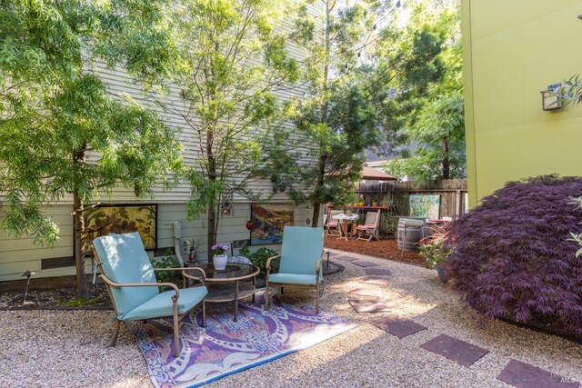 view of patio featuring fence