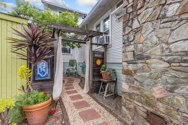 doorway to property with stone siding