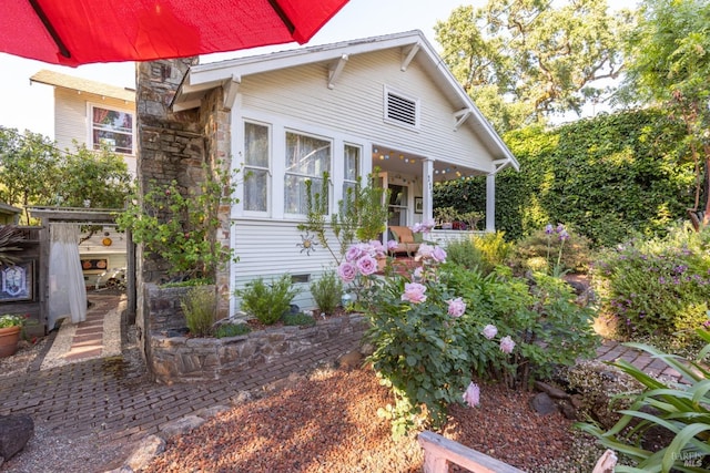 exterior space with stone siding