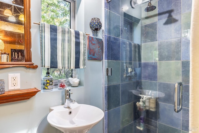 full bathroom with a sink and a stall shower