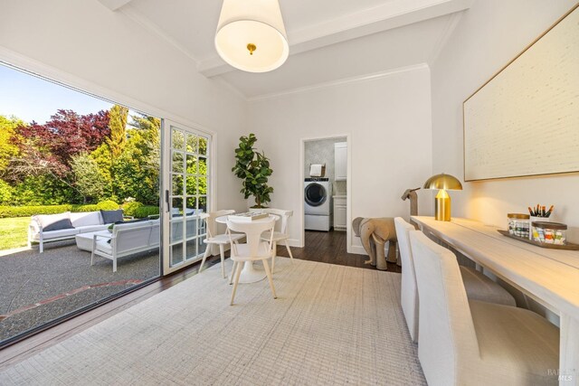 interior space with washer / dryer, crown molding, wood finished floors, and beamed ceiling