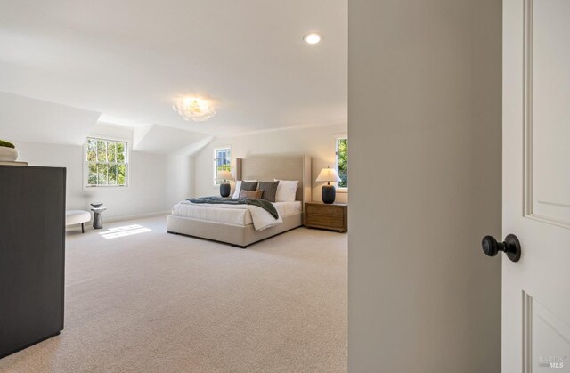 bedroom featuring light carpet, baseboards, and recessed lighting