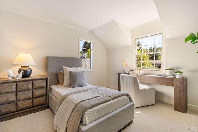 carpeted bedroom with ornamental molding, baseboards, and multiple windows