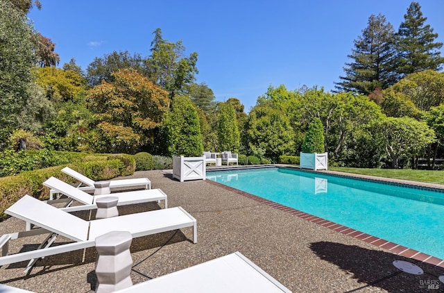 pool featuring a patio area