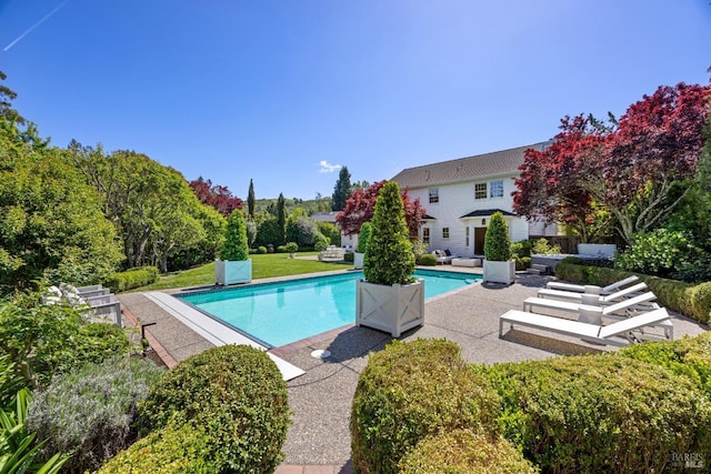 outdoor pool featuring a patio area