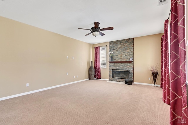 unfurnished living room with ceiling fan, a fireplace, baseboards, carpet flooring, and visible vents