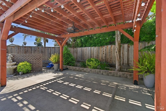 view of patio featuring a pergola, a fenced backyard, and ceiling fan