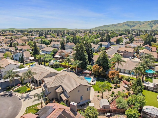 drone / aerial view featuring a mountain view and a residential view