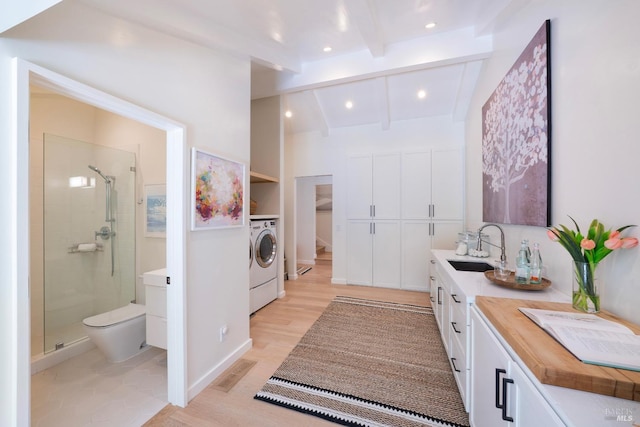 full bath featuring lofted ceiling with beams, washer / dryer, visible vents, and a stall shower