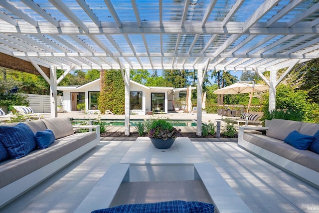 view of patio / terrace featuring a pergola, an outdoor hangout area, and an outdoor pool