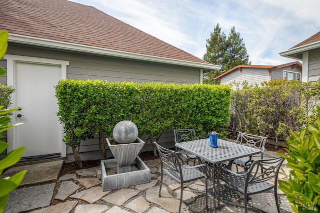 view of patio / terrace with outdoor dining area and fence