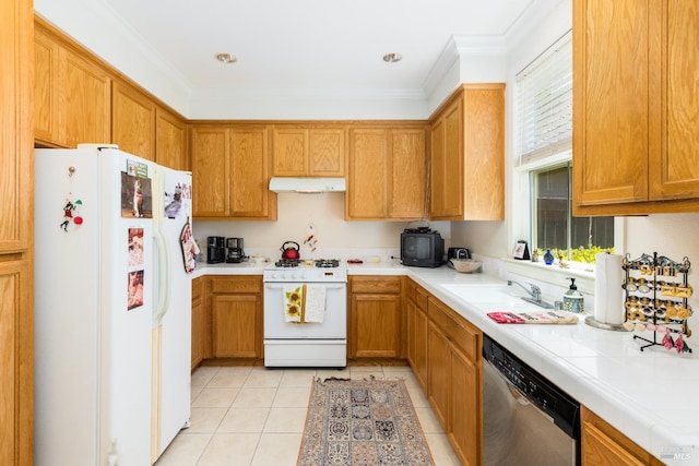 kitchen with tile countertops, under cabinet range hood, white appliances, light tile patterned floors, and ornamental molding