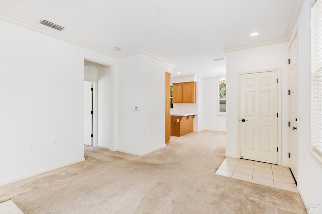 unfurnished room featuring light colored carpet, ornamental molding, visible vents, and recessed lighting