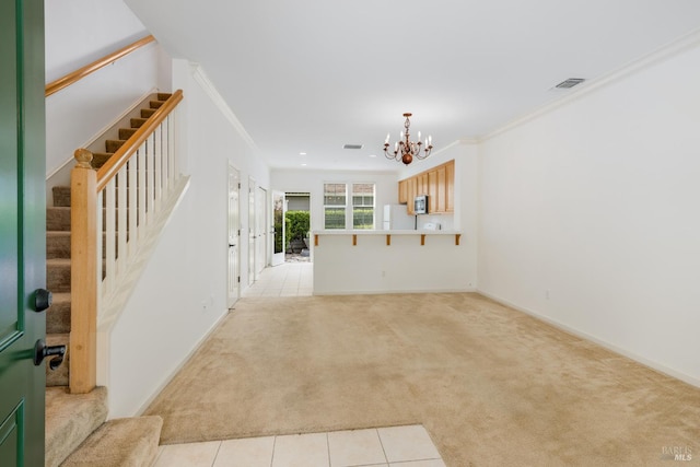 unfurnished living room with visible vents, stairs, light carpet, and an inviting chandelier