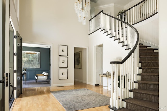 656 Goodhill Rd, Kentfield, CA 94904 - entryway featuring wood finished floors, a high ceiling, stairs, and a notable chandelier