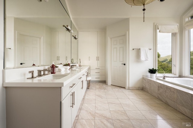 656 Goodhill Rd, Kentfield, CA 94904 - full bathroom featuring double vanity, a wealth of natural light, tiled tub, and a sink