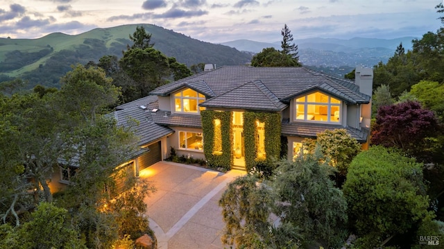 656 Goodhill Rd, Kentfield, CA 94904 - view of front of house featuring a chimney, an attached garage, a mountain view, and a tiled roof