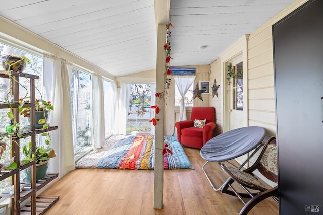 sunroom / solarium with vaulted ceiling, wood ceiling, and hardwood / wood-style flooring