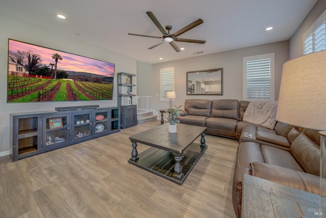 living area with visible vents, recessed lighting, ceiling fan, and wood finished floors