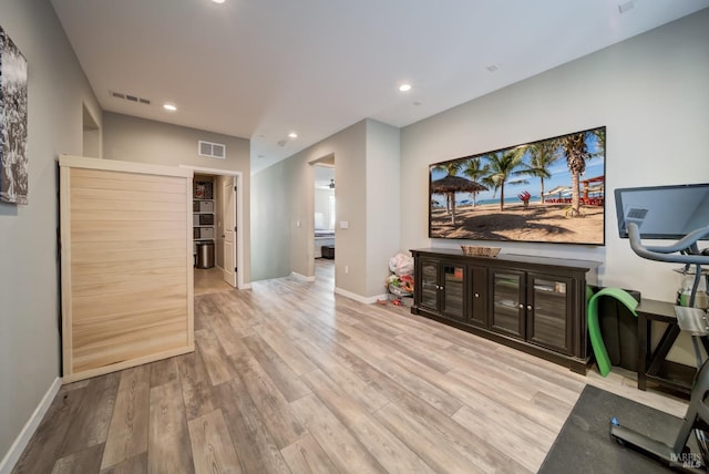 living area featuring recessed lighting, baseboards, visible vents, and wood finished floors