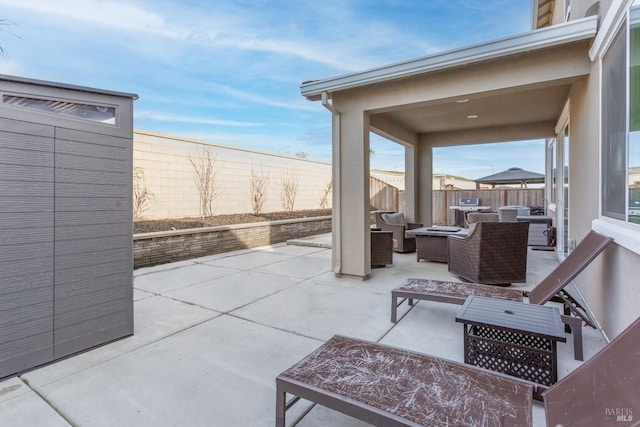 view of patio / terrace with an outdoor hangout area and a fenced backyard