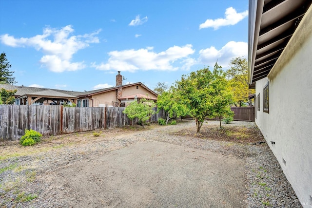 view of yard featuring a patio and a fenced backyard