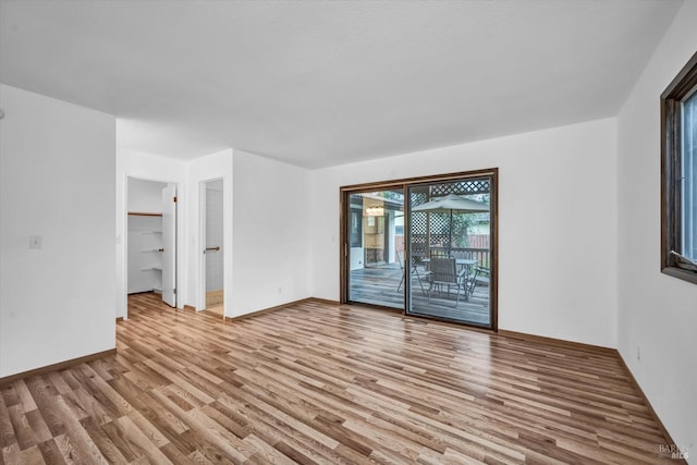 interior space with light wood-type flooring and baseboards