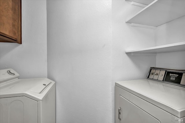 laundry area featuring cabinet space and washing machine and dryer