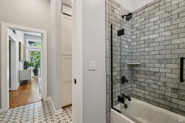 full bath featuring shower / bath combination with glass door, a healthy amount of sunlight, toilet, and vanity