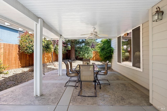 view of patio / terrace with a ceiling fan, outdoor dining space, and a fenced backyard