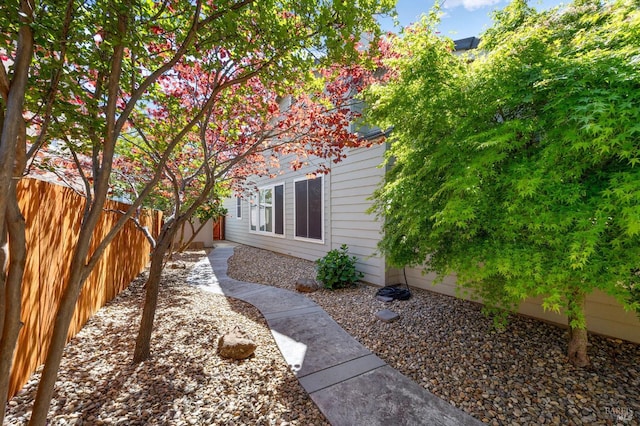 view of home's exterior featuring fence