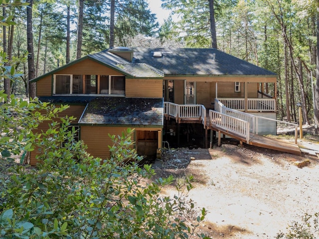 28900 Timberline Rd, Willits, CA 95490 - back of property featuring stairway, a sunroom, and a shingled roof