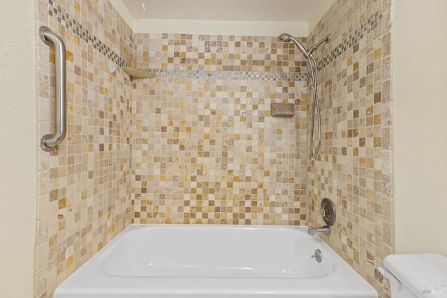 bathroom with shower / bathtub combination and toilet