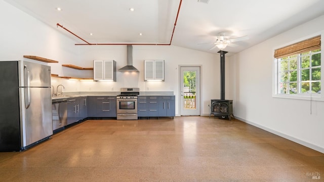 3880 Doris Murphy Ct, Occidental, CA 95465 - kitchen with stainless steel appliances, wall chimney exhaust hood, a ceiling fan, light countertops, and baseboards