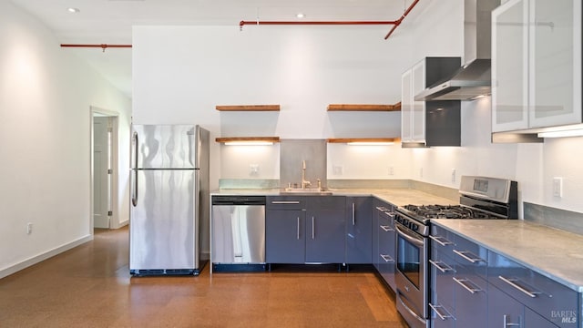 3880 Doris Murphy Ct, Occidental, CA 95465 - kitchen featuring appliances with stainless steel finishes, wall chimney range hood, open shelves, blue cabinetry, and light countertops