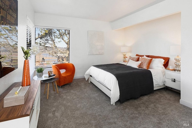 bedroom featuring carpet floors and baseboards